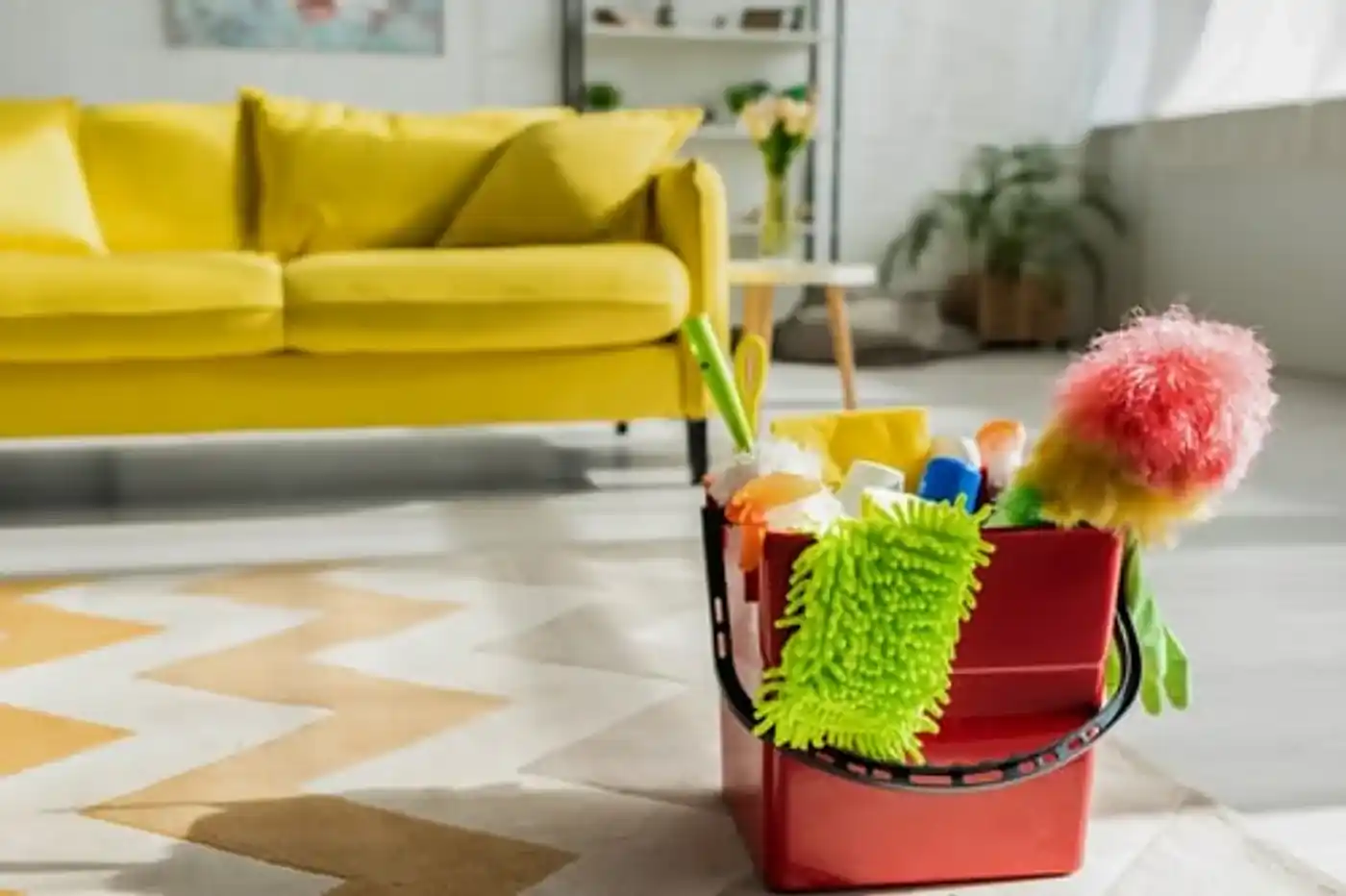 Warm living room with a cleaning caddy ready for a scheduled recurring visit